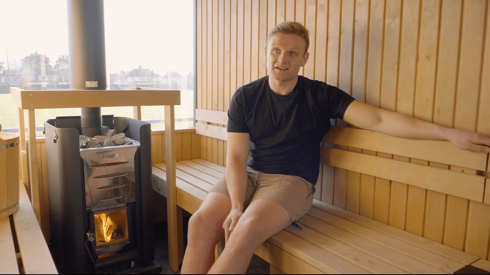 Host your sauna – welcoming sauna interior with wood stove